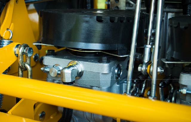 Close up of hydro gear drive system through service panel in rear of mower